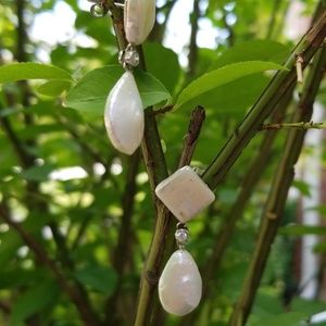Irridessent drop earrings.
